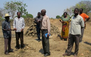 Government officials inspecting the construction site with chiefs and Kindle staff