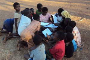 Children in a youth group, putting the words of a Bible verse in the correct order